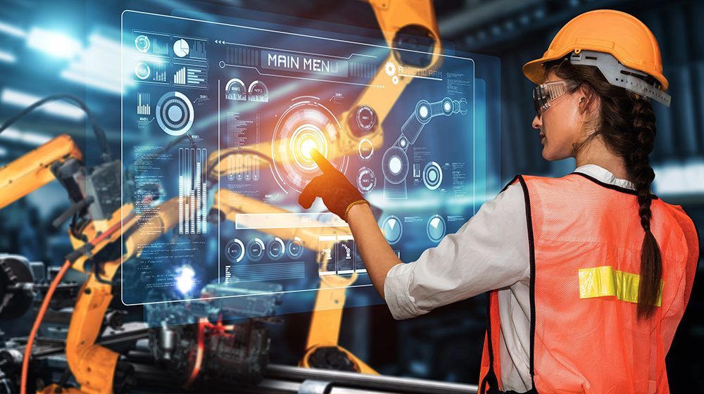 /unimagdeburg_media/Presse/Bilder/Pressemitteilungen/2025/Eine+junge+Ingenieurin+in+Arbeitsschutzkleidung+steht+an+einem+Display+und+nutzt+K%C3%BCnstliche+Intelligenz+zur+Programmierung+einer+technischen+Anlage+%28c%29+Shutterstock+Summit+Art+Creations-height-560-width-1000.jpg
